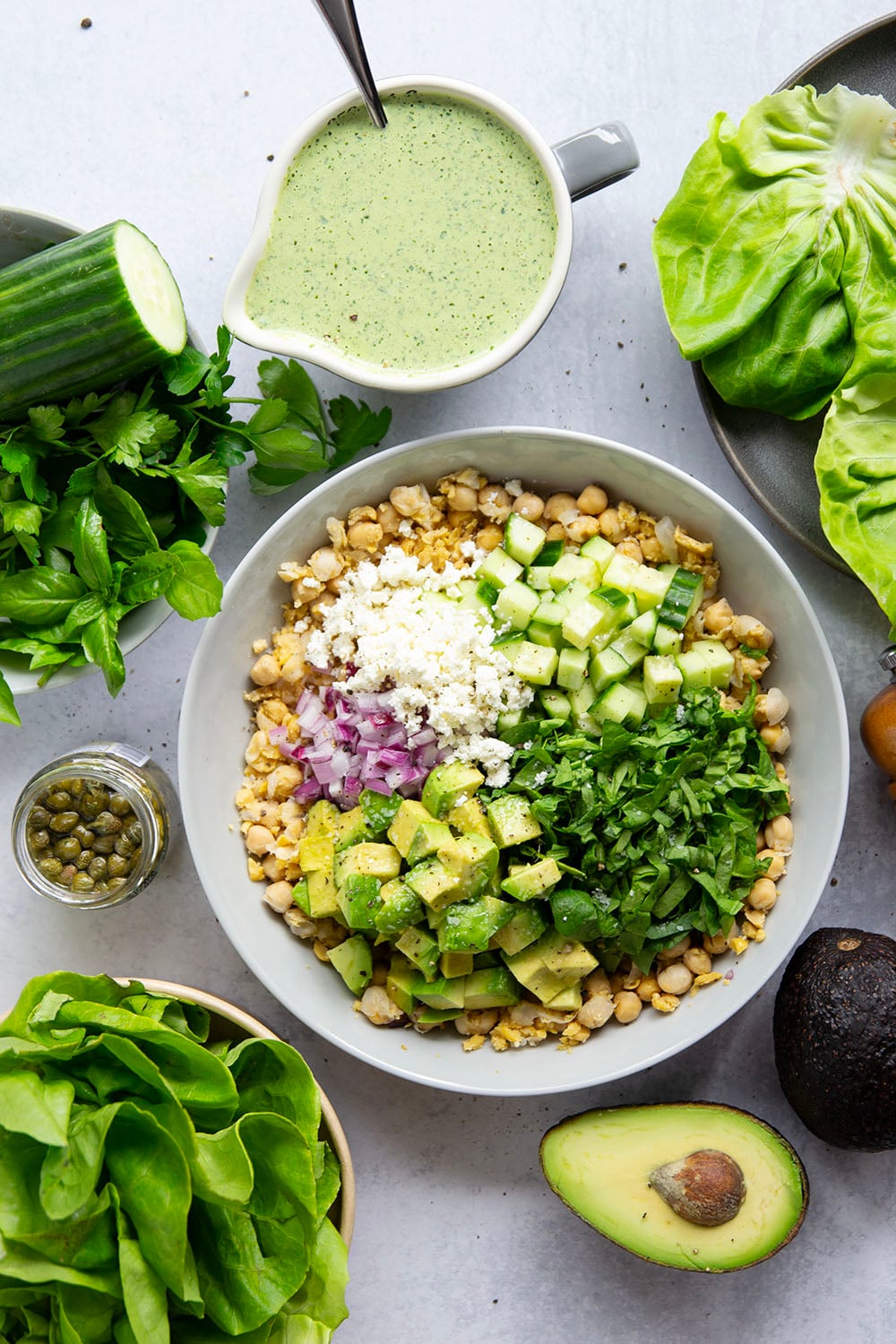 Smashed chickpeas, crunchy cucumber, and an herby green goddess sauce pack tons of flavor into these light, yet filling chickpea lettuce wraps.