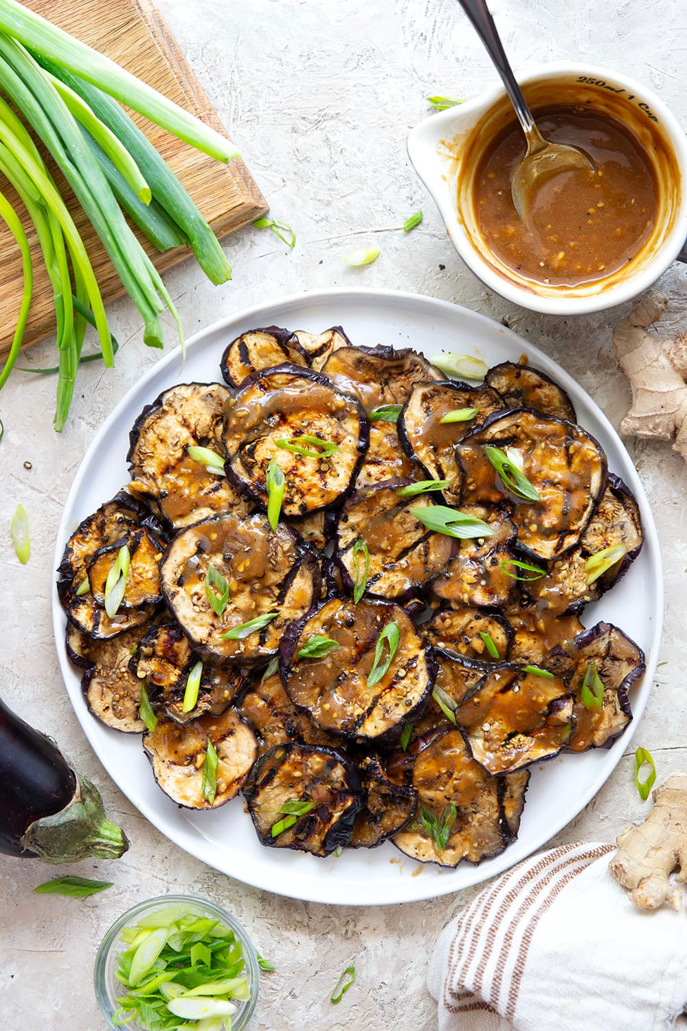Grilled until crispy and drizzled in a flavorful miso ginger sauce, this miso grilled eggplant is the perfect way to use an abundance of eggplant and goes well with any Asian-inspired meal.