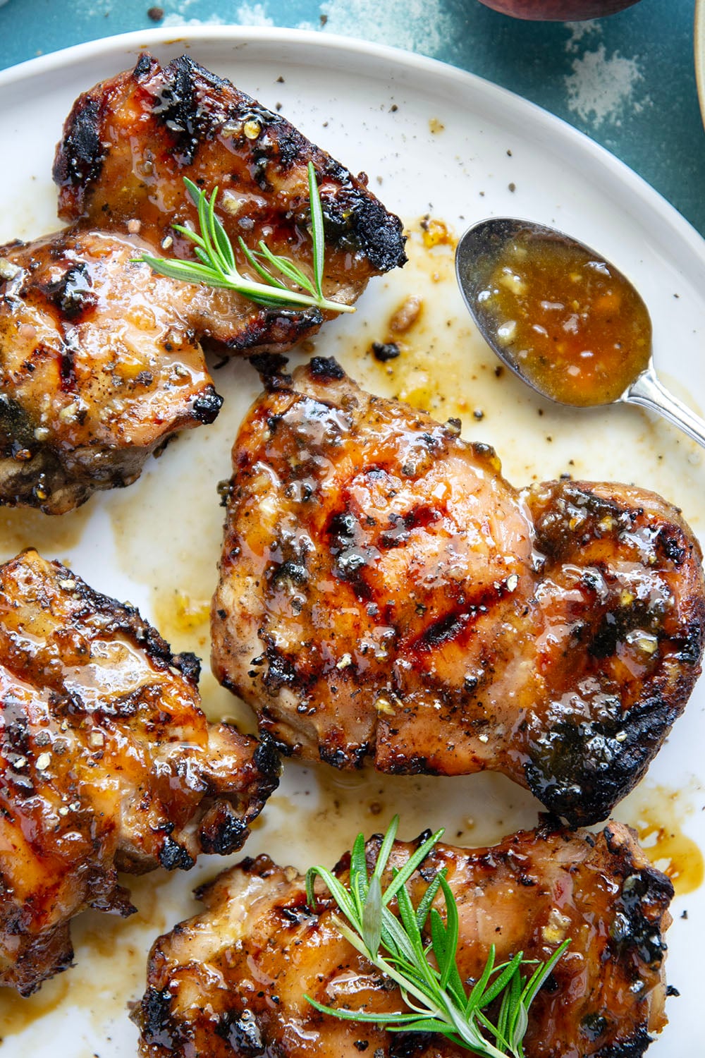 A sweet, jammy honey peach glaze coats every inch of juicy grilled chicken thighs in this peach glazed chicken that's incredible with fresh summer peaches.