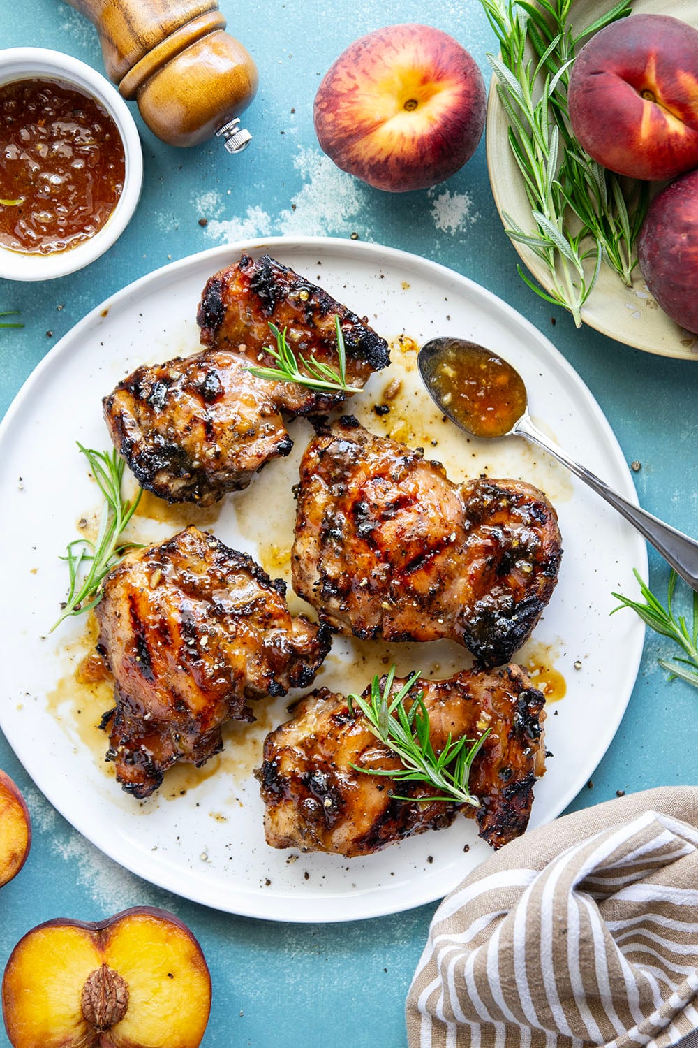 A sweet, jammy honey peach glaze coats every inch of juicy grilled chicken thighs in this peach glazed chicken that's incredible with fresh summer peaches.
