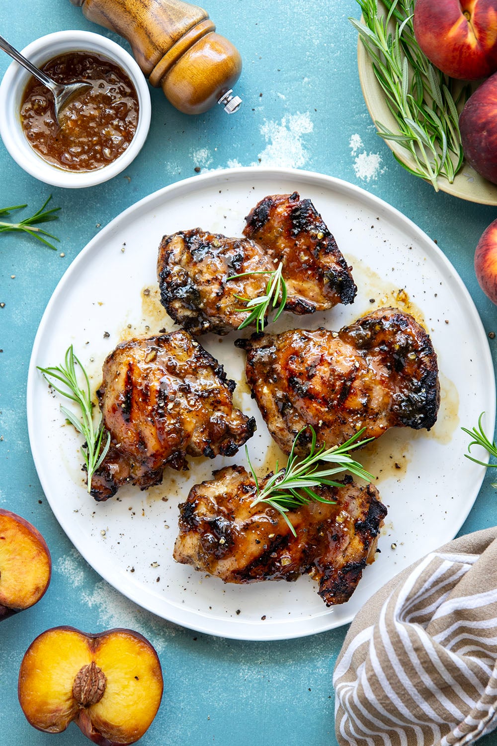 A sweet, jammy honey peach glaze coats every inch of juicy grilled chicken thighs in this peach glazed chicken that's incredible with fresh summer peaches.