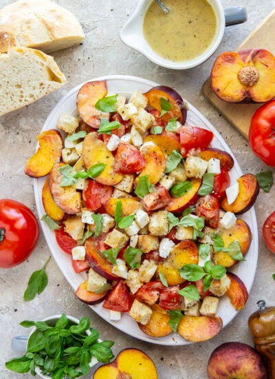 This summery peach panzanella salad is loaded down with crisp toasted bread, juicy peach slices, sweet tomatoes, and lots of fresh basil. A flavorful shallot dressing drizzled on top adds so much flavor!
