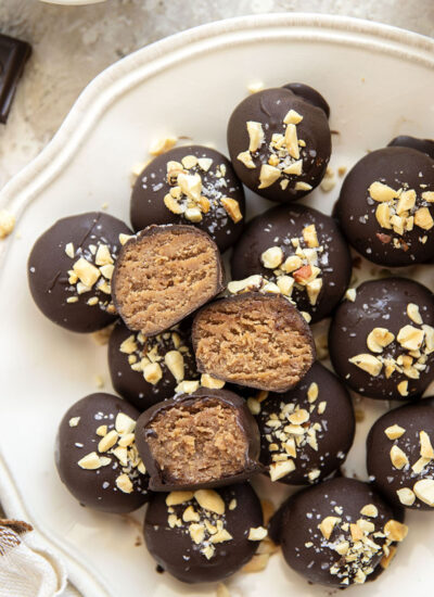 These protein peanut butter balls take only a handful of ingredients to throw together and taste exactly like a peanut butter cup!