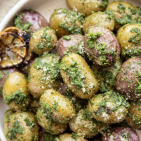 These pesto roasted potatoes feature tender, crispy roasted fingerling potatoes tossed in a homemade lemon kale pesto.