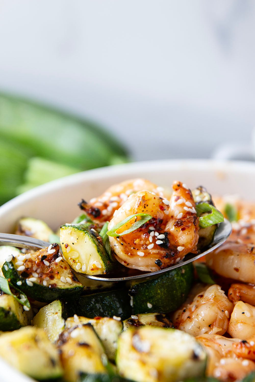 Grilled in spicy sweet chili sauce alongside tender zucchini cubes, this grilled sweet chili shrimp is a quick summer meal that's fantastic as an appetizer or served alongside rice.