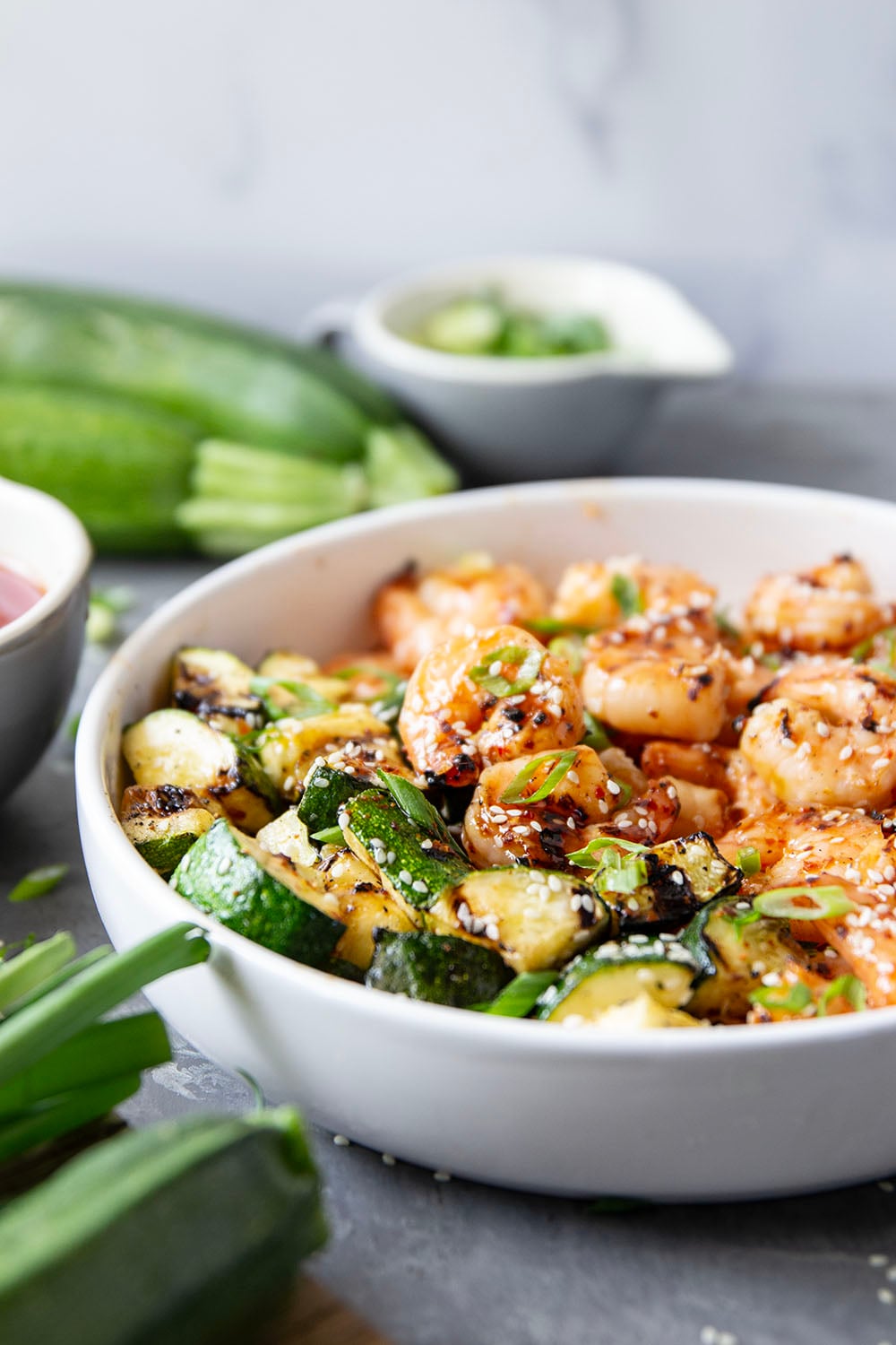 Grilled in spicy sweet chili sauce alongside tender zucchini cubes, this grilled sweet chili shrimp is a quick summer meal that's fantastic as an appetizer or served alongside rice.
