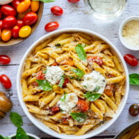 Garden-fresh burst tomato pasta features juicy cherry tomatoes cooked in flavorful white wine with lots of fresh garlic and basil.
