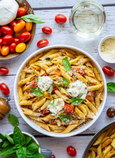 Garden-fresh burst tomato pasta features juicy cherry tomatoes cooked in flavorful white wine with lots of fresh garlic and basil.
