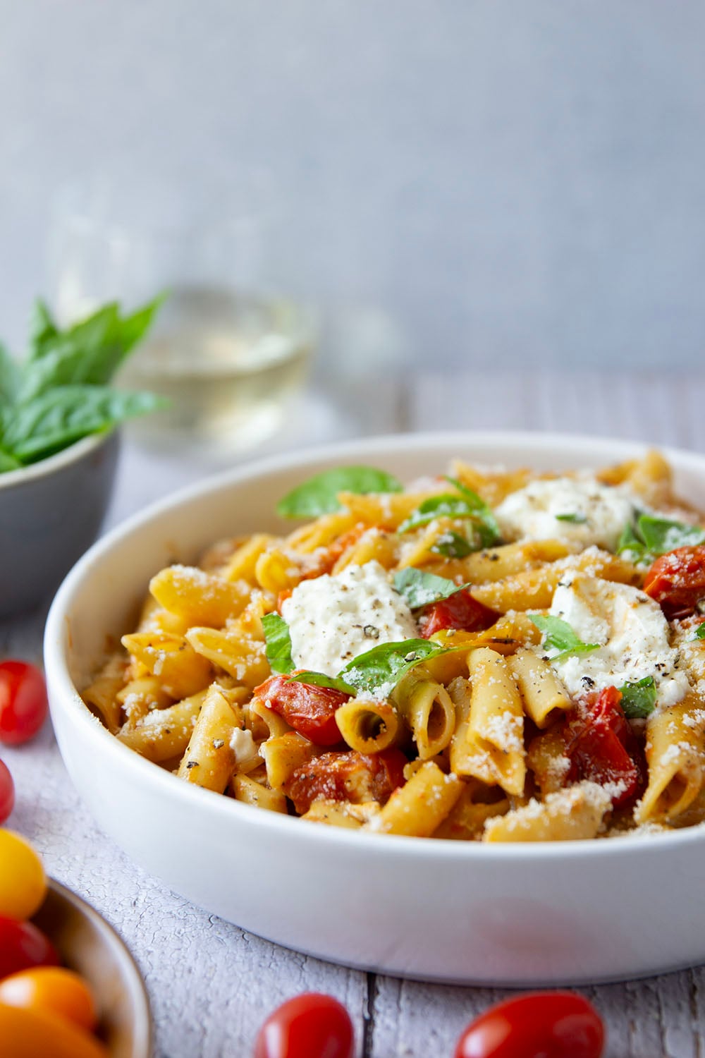 Garden-fresh burst tomato pasta features juicy cherry tomatoes cooked in flavorful white wine with lots of fresh garlic and basil.