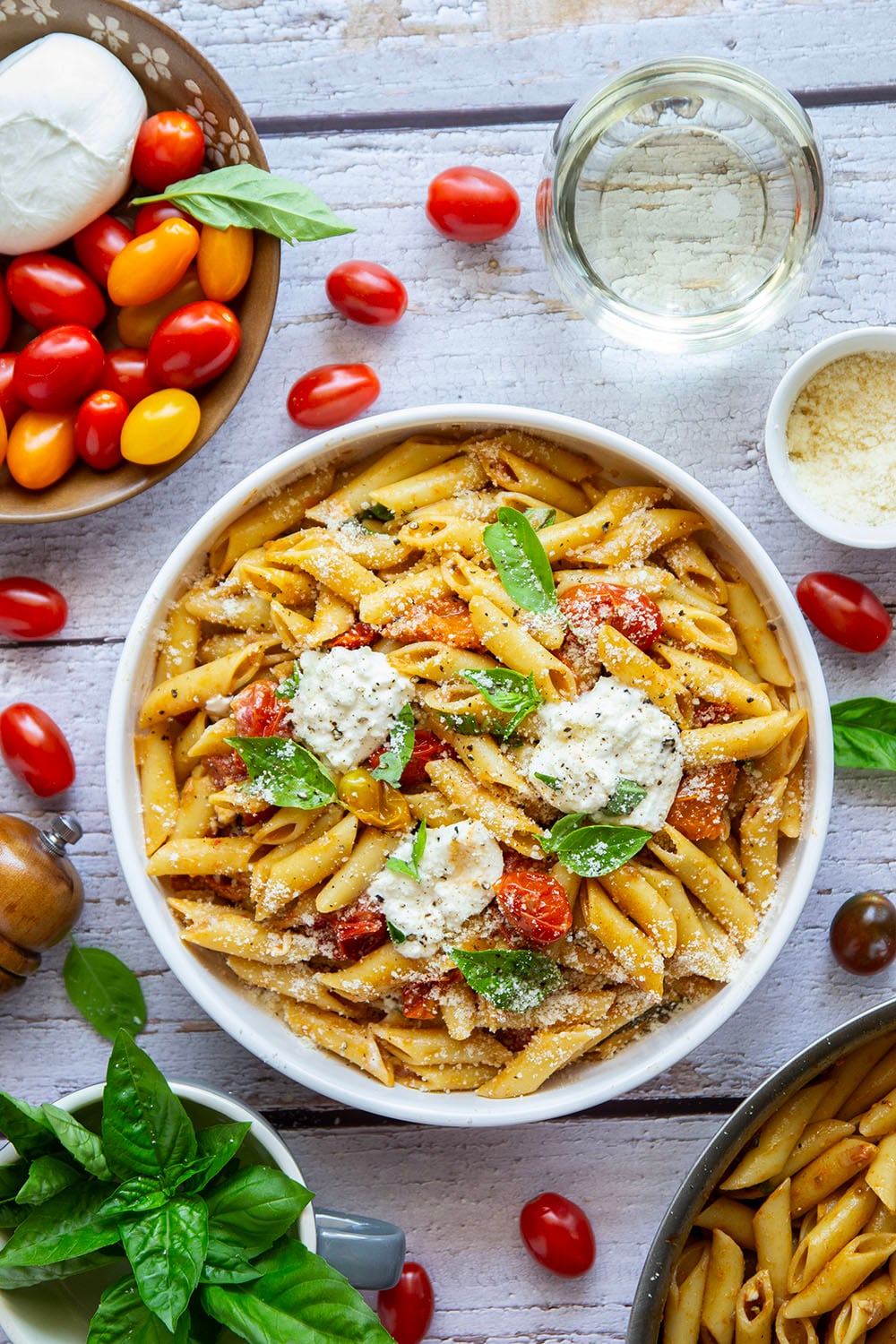 Garden-fresh burst tomato pasta features juicy cherry tomatoes cooked in flavorful white wine with lots of fresh garlic and basil.