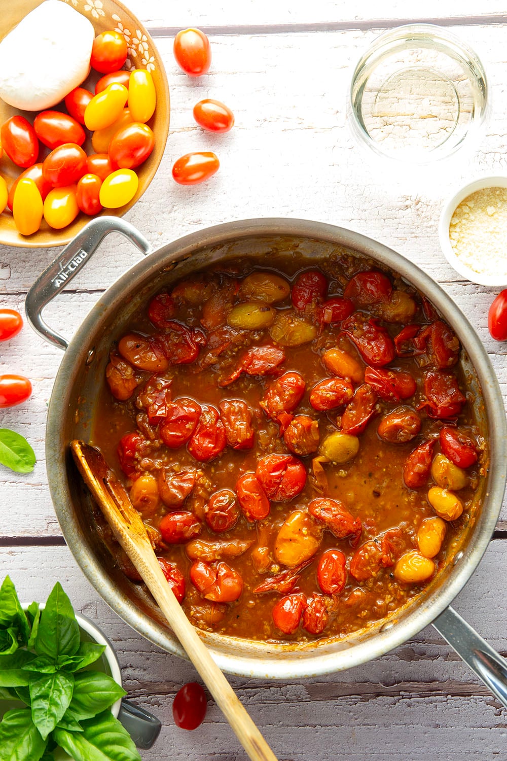 Garden-fresh burst tomato pasta features juicy cherry tomatoes cooked in flavorful white wine with lots of fresh garlic and basil.