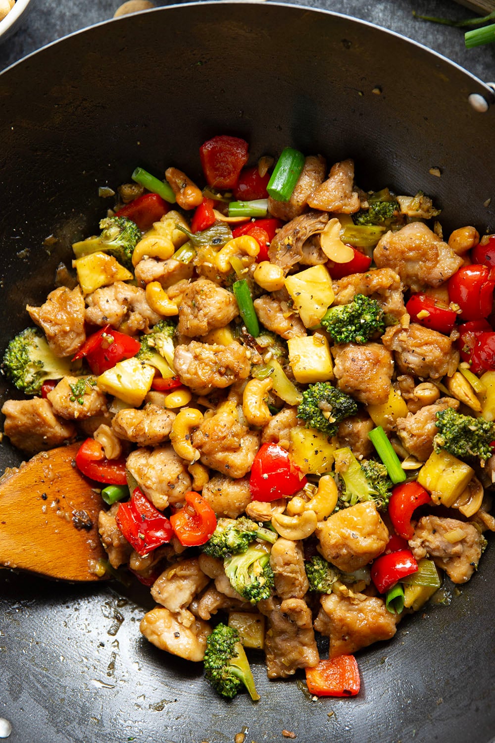 Crunchy cashews and sweet pineapple deliver an incredible contrast of flavors and textures in this sweet and saucy pineapple chicken stir fry.