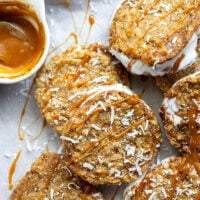 A base of crispy coconut cookies, homemade salted caramel, and a filling of creamy vanilla ice cream take these caramel ice cream sandwiches completely over the top!