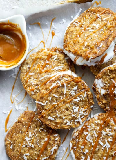 A base of crispy coconut cookies, homemade salted caramel, and a filling of creamy vanilla ice cream take these caramel ice cream sandwiches completely over the top!