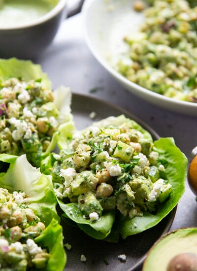 Smashed chickpeas, crunchy cucumber, and an herby green goddess sauce pack tons of flavor into these light, yet filling chickpea lettuce wraps.