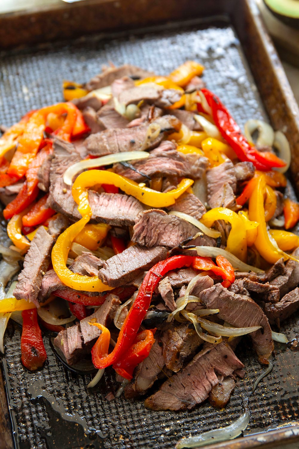 Juicy grilled sirloin steak, sweet peppers, and an herby fresh chimichurri sauce make for the ultimate summer steak fajita bowls.