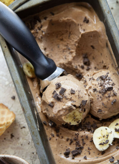Rich brewed coffee and crunchy chocolate pieces star in this creamy coffee banana ice cream that's entirely banana-based and doesn't even require an ice cream maker!