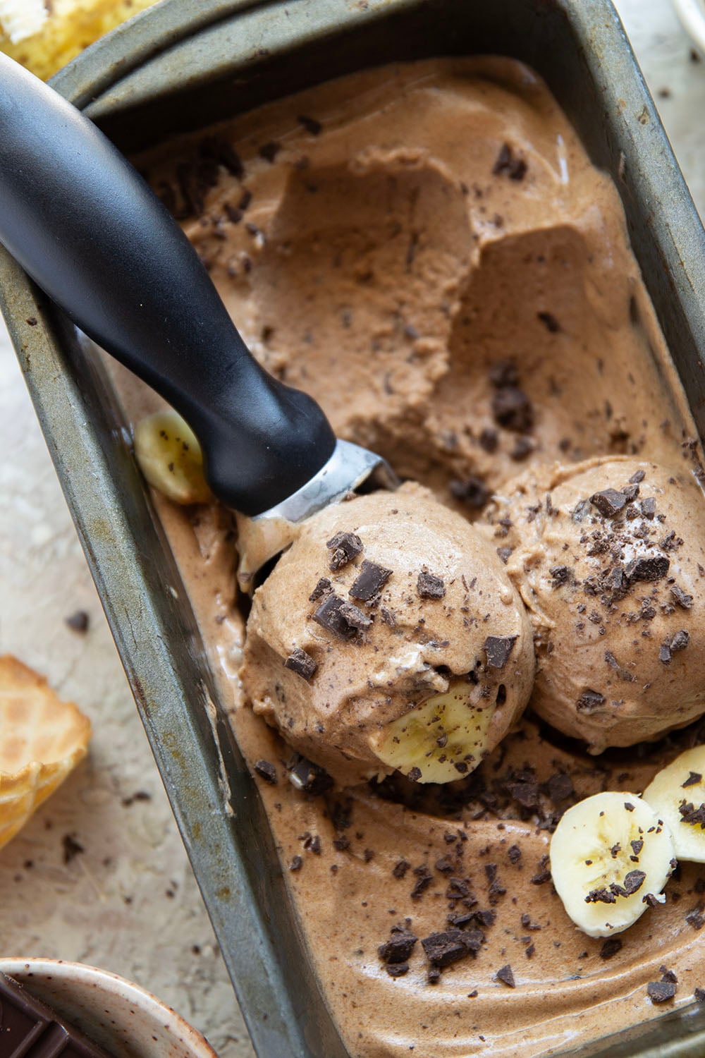 Rich brewed coffee and crunchy chocolate pieces star in this creamy coffee banana ice cream that's entirely banana-based and doesn't even require an ice cream maker!