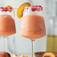 These peach raspberry wine slushies are exploding with sweet summer peaches and raspberries. They blend up in minutes and you can easily double the recipe for a crowd.