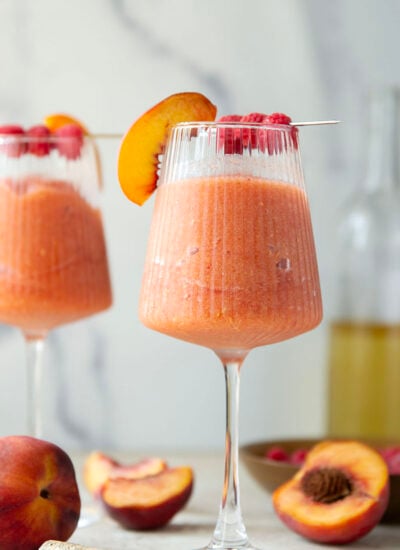These peach raspberry wine slushies are exploding with sweet summer peaches and raspberries. They blend up in minutes and you can easily double the recipe for a crowd.