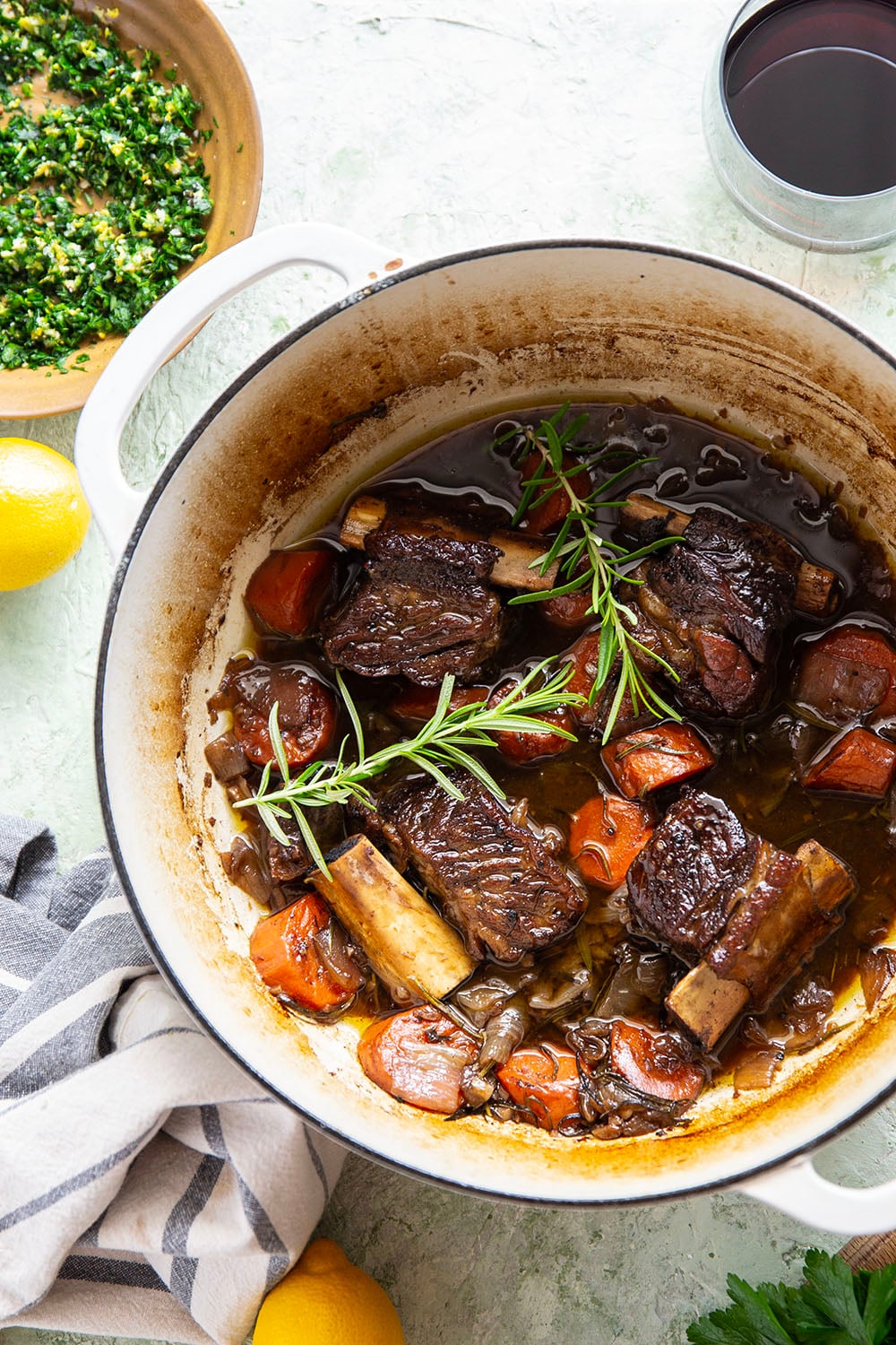 Fall-apart tender beef short ribs with gremolata feature red wine-braised short ribs cooked for hours until tender and topped with a fresh, herby gremolata topping.