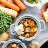 Warm and cozy bowls of quinoa chicken soup feature fall vegetables, lots of fluffy quinoa, and tender chicken cubes in a rich, flavorful broth.