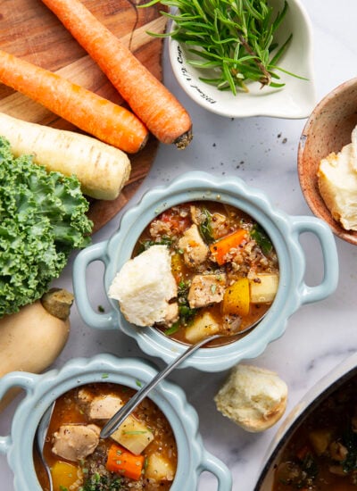 Warm and cozy bowls of quinoa chicken soup feature fall vegetables, lots of fluffy quinoa, and tender chicken cubes in a rich, flavorful broth.