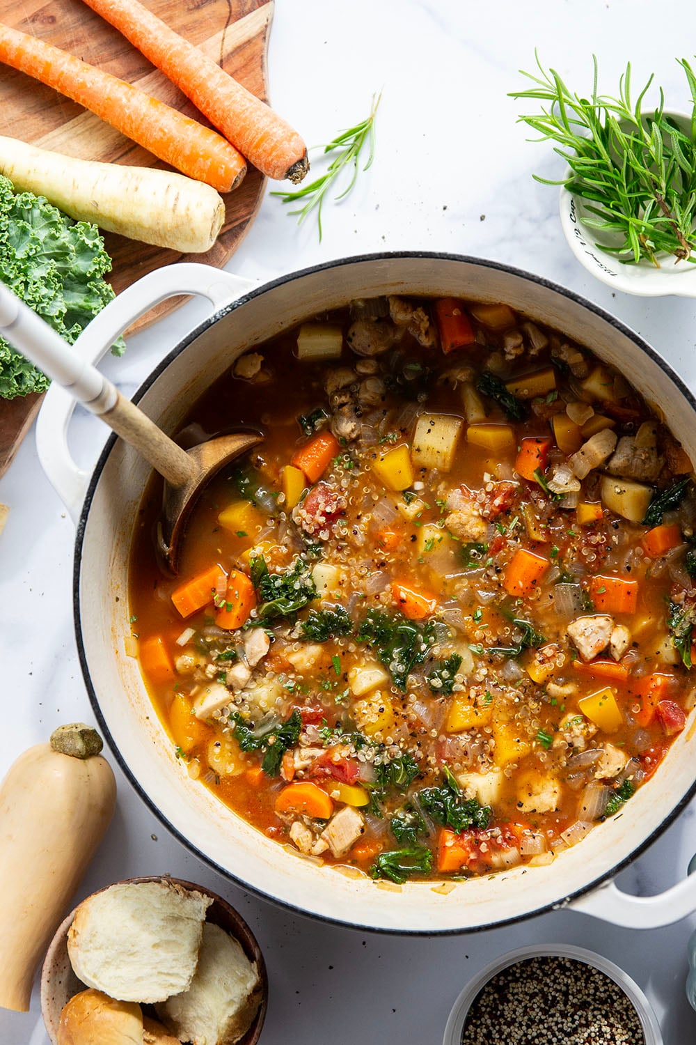 Warm and cozy bowls of quinoa chicken soup feature fall vegetables, lots of fluffy quinoa, and tender chicken cubes in a rich, flavorful broth.