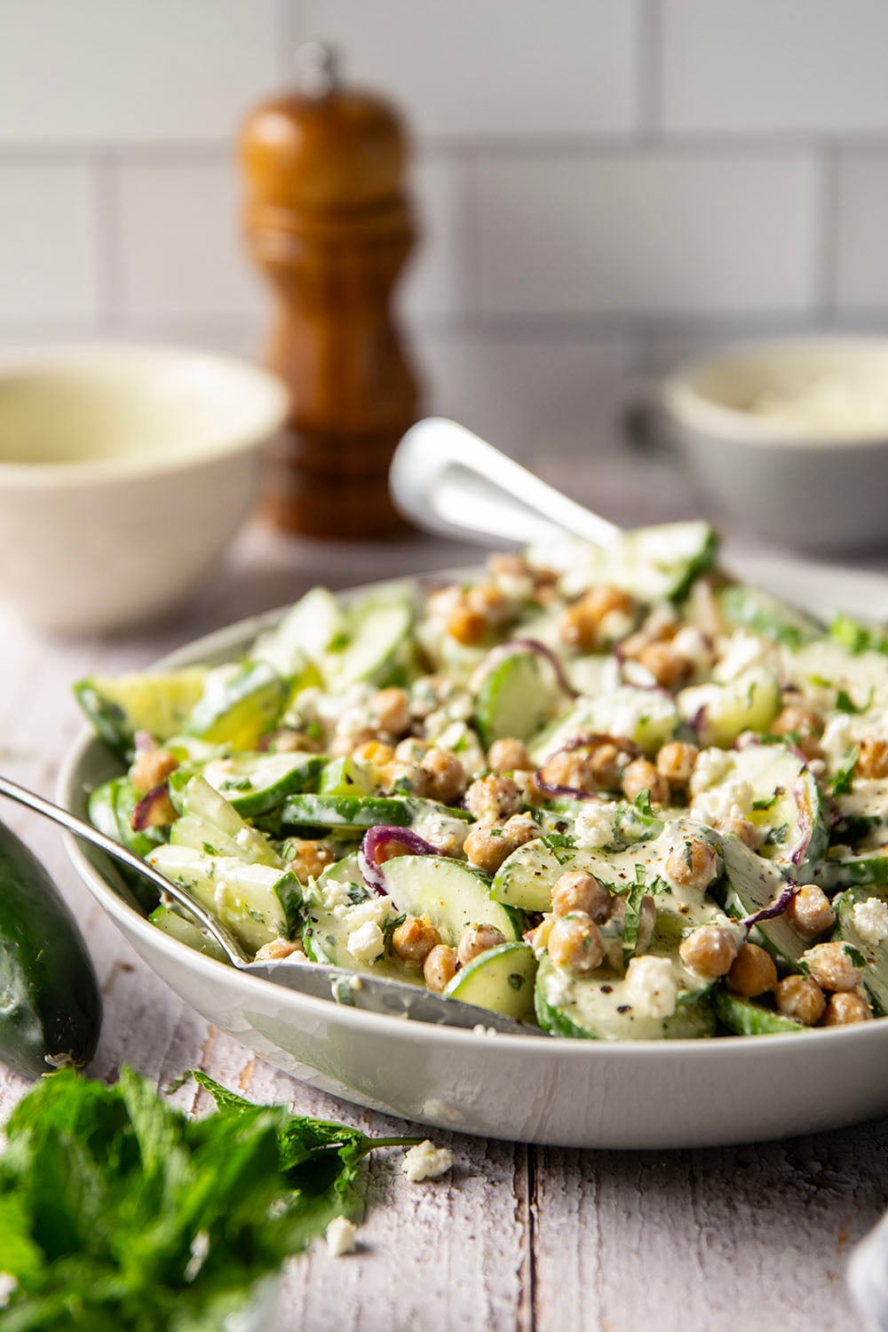 Crispy roasted chickpeas, crunchy cucumber slices, and a cool, creamy mint dressing work incredibly well together in this quick and easy chickpea cucumber salad.