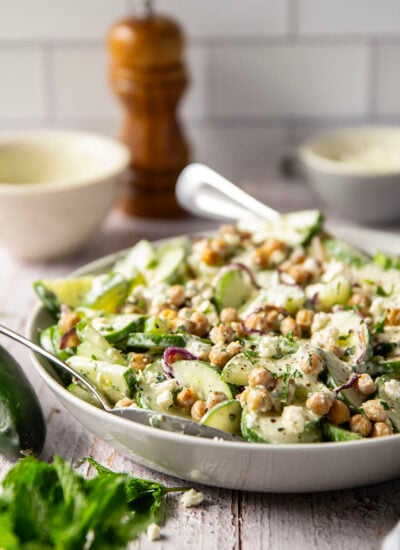 Crispy roasted chickpeas, crunchy cucumber slices, and a cool, creamy mint dressing work incredibly well together in this quick and easy chickpea cucumber salad.