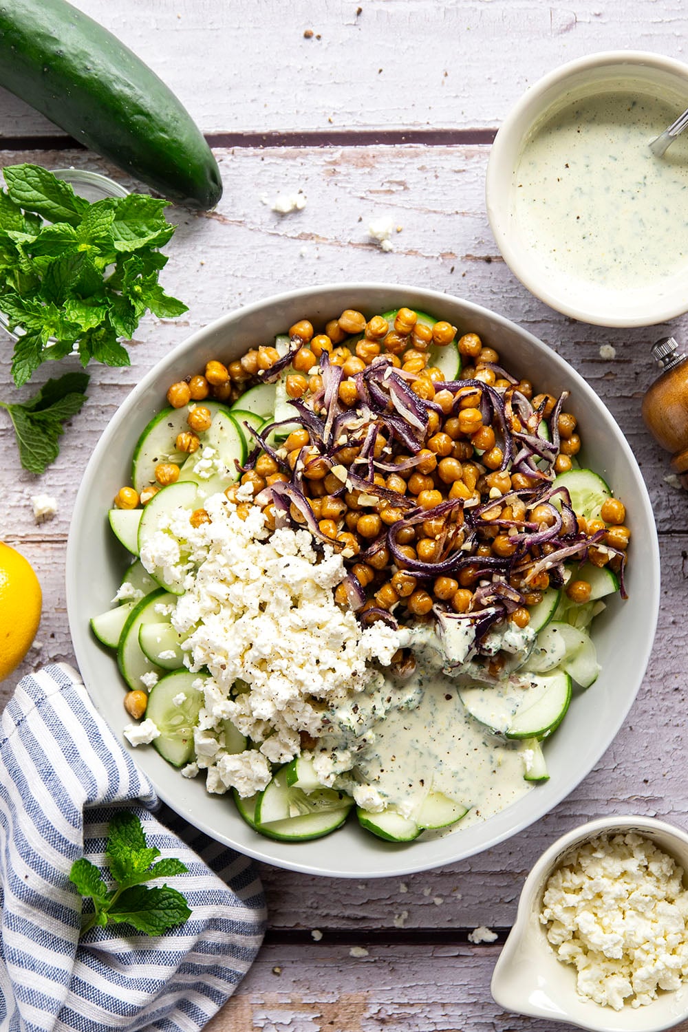 Crispy roasted chickpeas, crunchy cucumber slices, and a cool, creamy mint dressing work incredibly well together in this quick and easy chickpea cucumber salad.