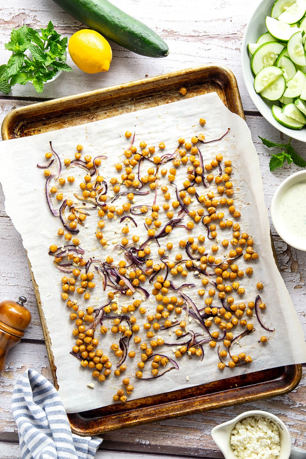 Crispy roasted chickpeas, crunchy cucumber slices, and a cool, creamy mint dressing work incredibly well together in this quick and easy chickpea cucumber salad.