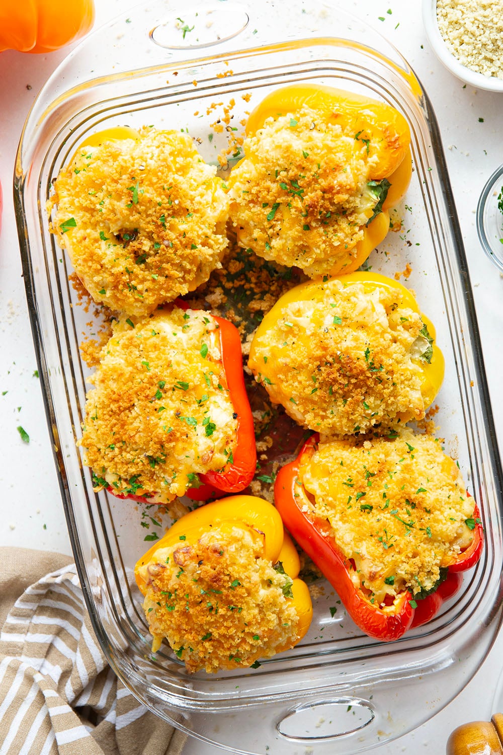 Rich and cheesy mac and cheese stuffed peppers feature tender sweet peppers stuffed with creamy mac and cheese with lots of crispy breadcrumbs on top.