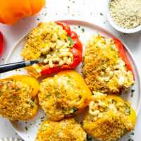 Rich and cheesy mac and cheese stuffed peppers feature tender sweet peppers stuffed with creamy mac and cheese with lots of crispy breadcrumbs on top.