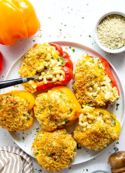 Rich and cheesy mac and cheese stuffed peppers feature tender sweet peppers stuffed with creamy mac and cheese with lots of crispy breadcrumbs on top.