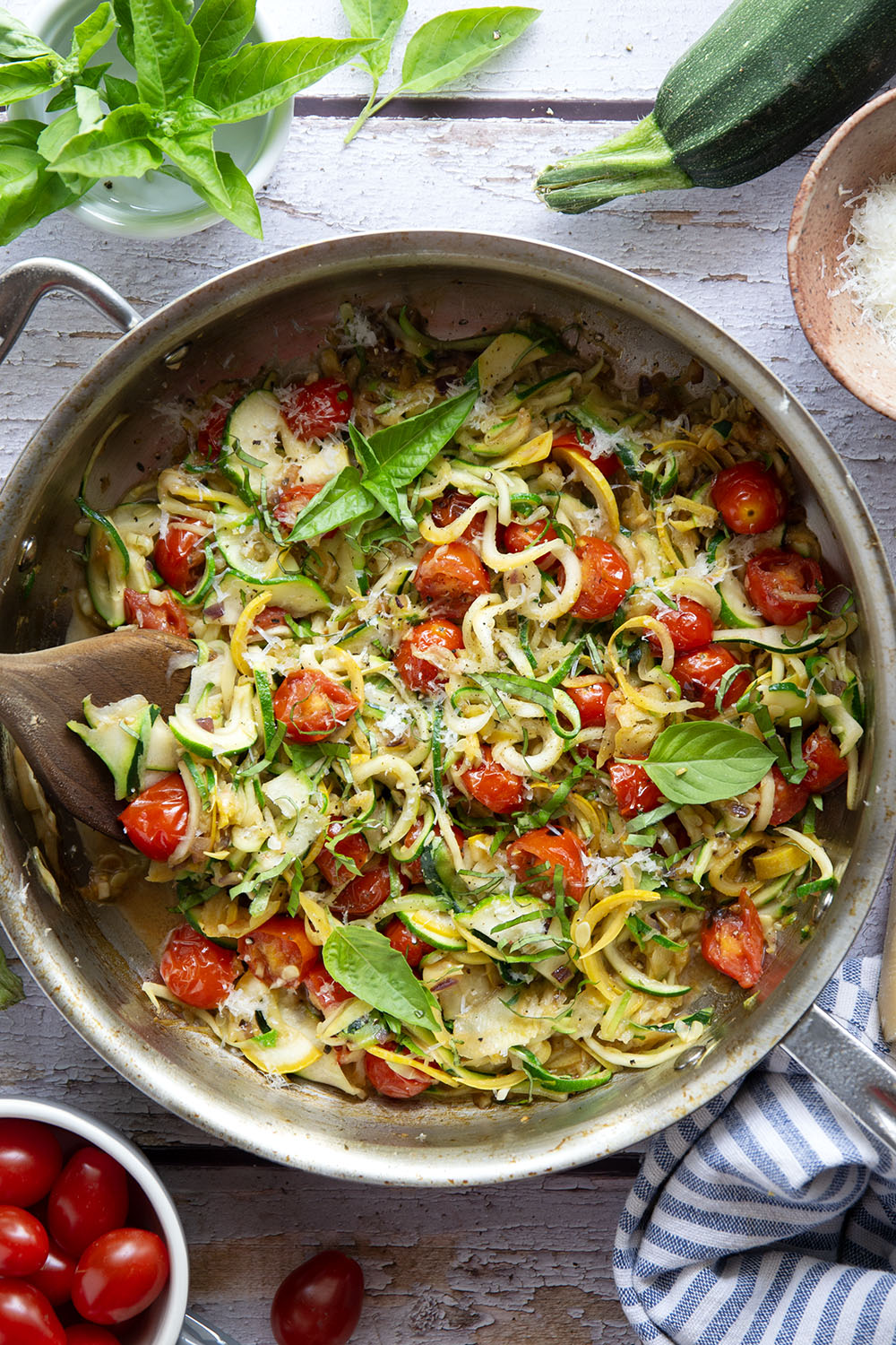 Made in one pan in only 10 minutes and loaded with freshly grated Parmesan and lots of fresh garlic, these garlic Parmesan zucchini noodles are a side dish that goes well with any summer meal.
