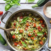 Made in one pan in only 10 minutes and loaded with freshly grated Parmesan and lots of fresh garlic, these garlic Parmesan zucchini noodles are a side dish that goes well with any summer meal.