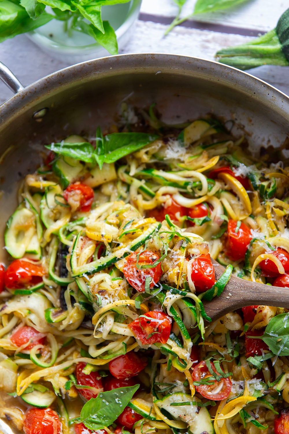 Made in one pan in only 10 minutes and loaded with freshly grated Parmesan and lots of fresh garlic, these garlic Parmesan zucchini noodles are a side dish that goes well with any summer meal.