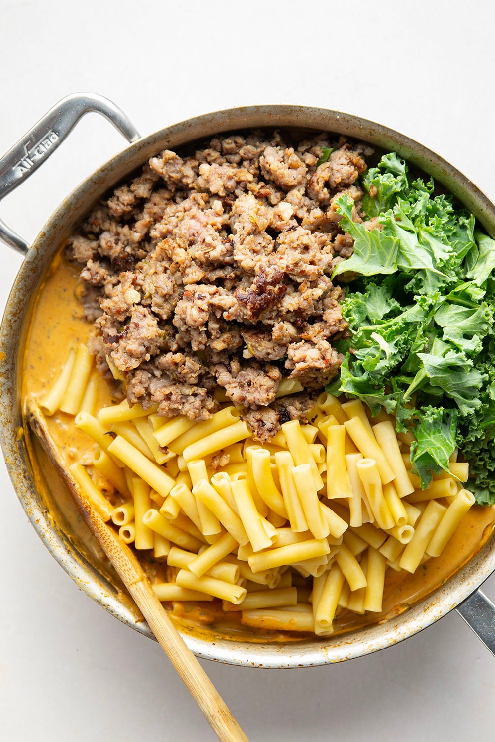 Baked in a creamy pumpkin white sauce with two kinds of cheese and tender sausage bits, this pumpkin baked ziti is a fun fall twist on the classic comfort dish.