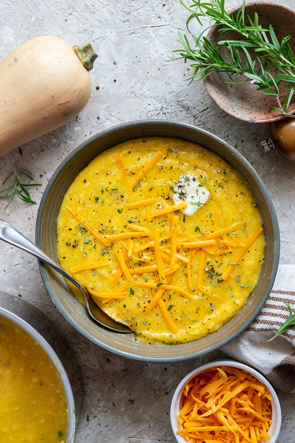 Sharp melted cheddar cheese and creamy homemade butternut squash puree make an incredible fall pairing in this rich and creamy butternut squash polenta.