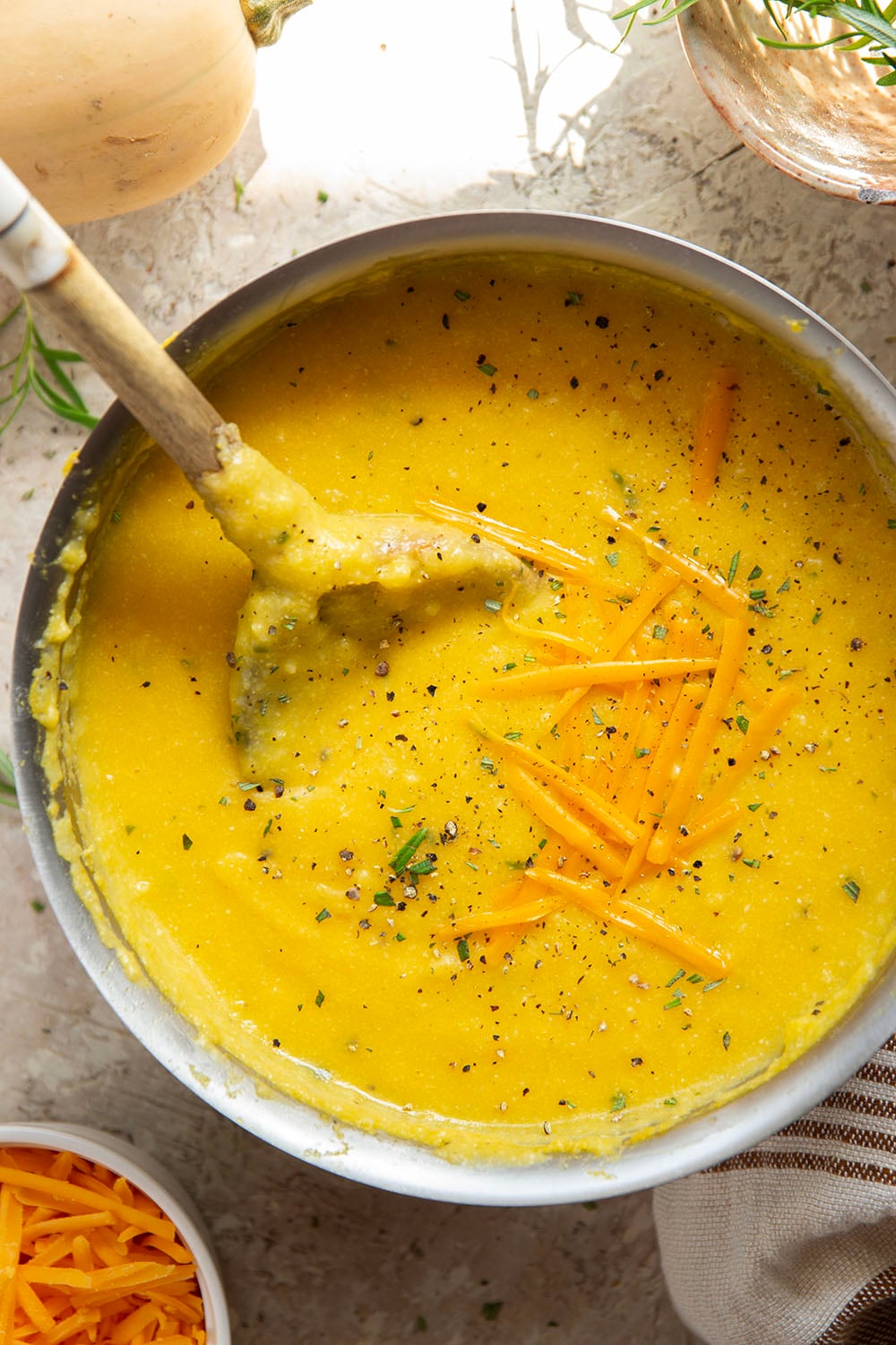 Sharp melted cheddar cheese and creamy homemade butternut squash puree make an incredible fall pairing in this rich and creamy butternut squash polenta.