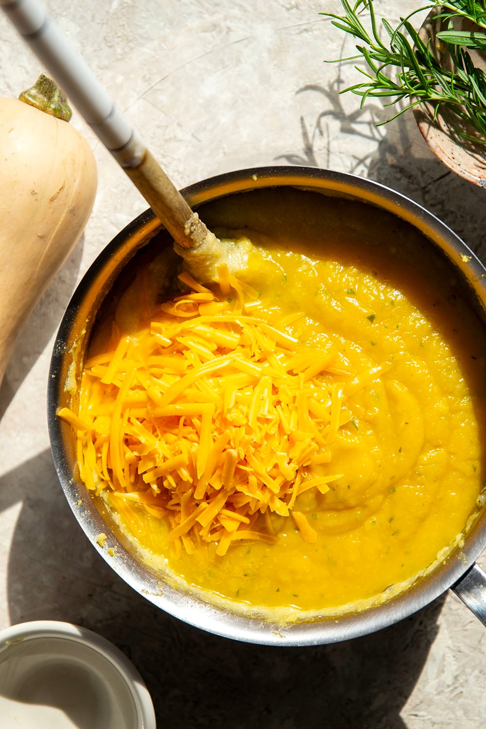 Sharp melted cheddar cheese and creamy homemade butternut squash puree make an incredible fall pairing in this rich and creamy butternut squash polenta.