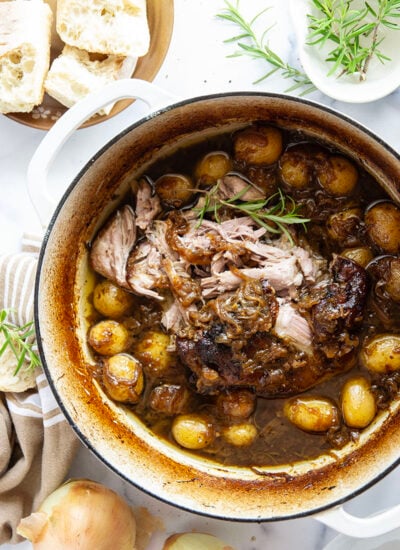 Braised for hours in a caramelized onion sauce with lots of hearty potatoes, this braised pork shoulder cooks up fall-apart tender and makes a great meat entree for any occasion.