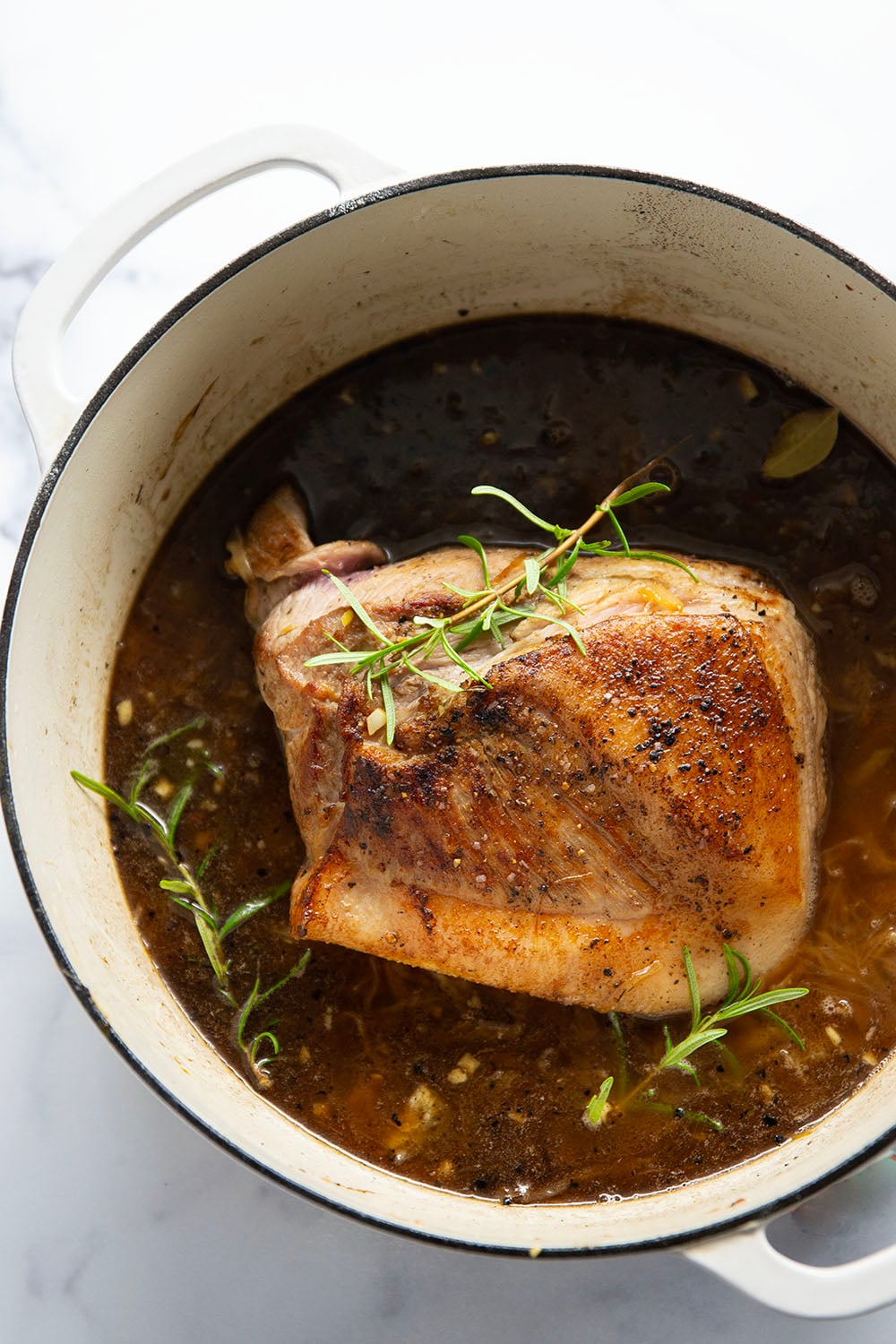 Braised for hours in a caramelized onion sauce with lots of hearty potatoes, this braised pork shoulder cooks up fall-apart tender and makes a great meat entree for any occasion.