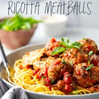 Moist and tender chicken ricotta meatballs are simmered in a flavorful roasted red pepper tomato sauce and are amazing served over spaghetti with lots of Parmesan and basil on top.