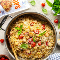 Garlicky scallops, bursting tomatoes, and lots of fresh Parmesan cheese star in this garlic Parmesan scallop pasta that comes together in minutes for an elevated weeknight meal.