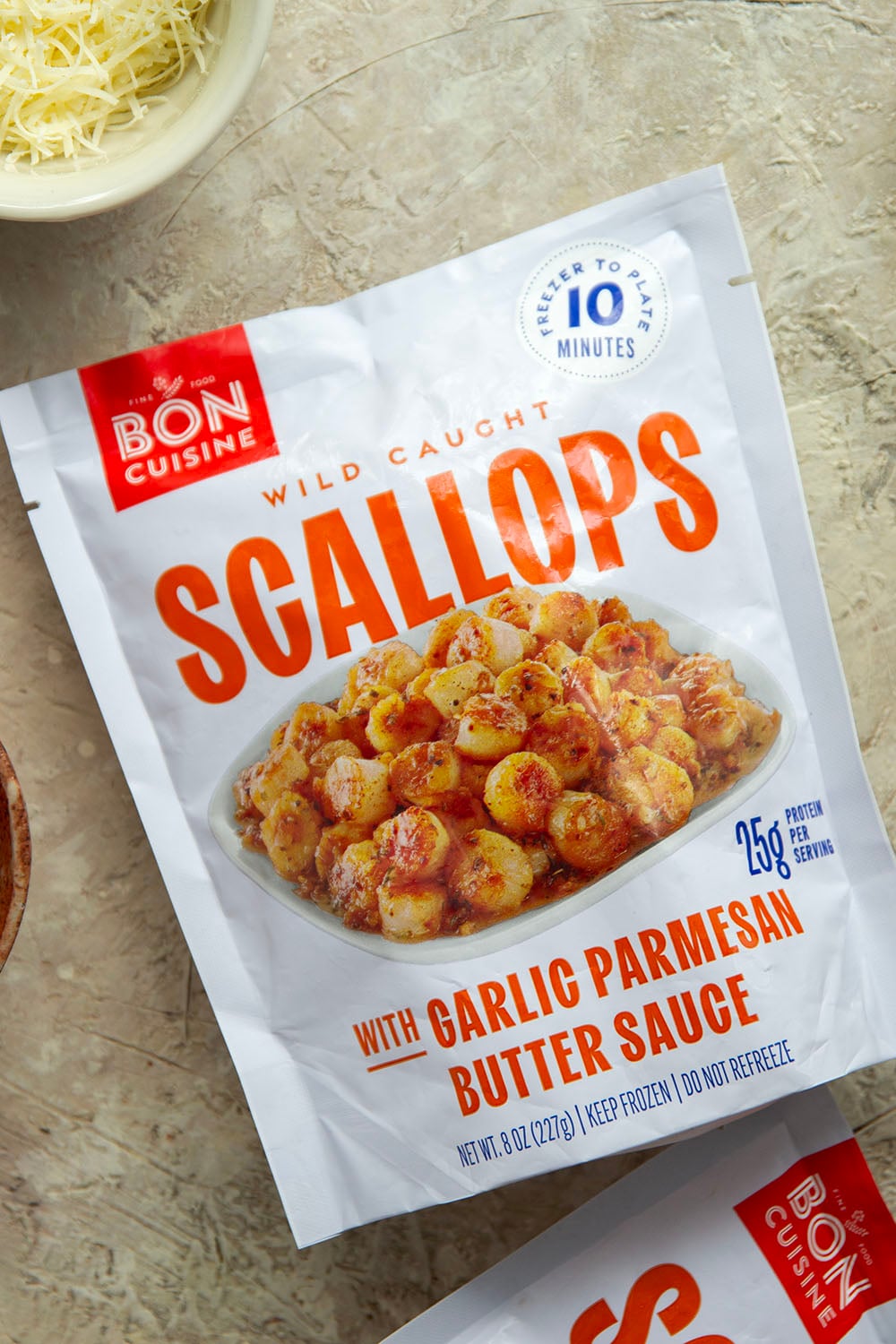 Garlicky scallops, bursting tomatoes, and lots of fresh Parmesan cheese star in this garlic Parmesan scallop pasta that comes together in minutes for an elevated weeknight meal.