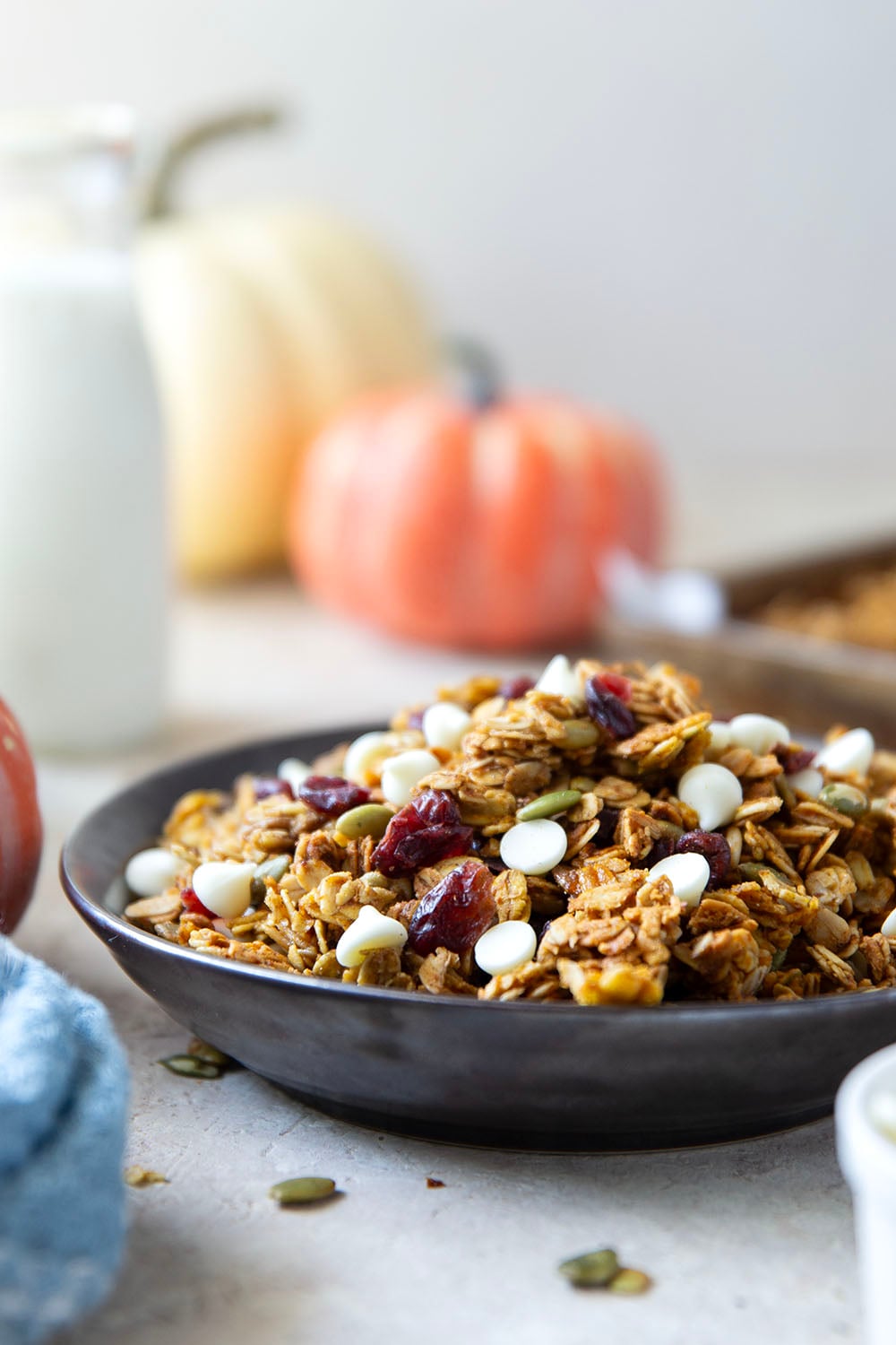This crisp pumpkin granola has a delightful fall twist of warming spices, real pumpkin puree, white chocolate, and dried cranberries.