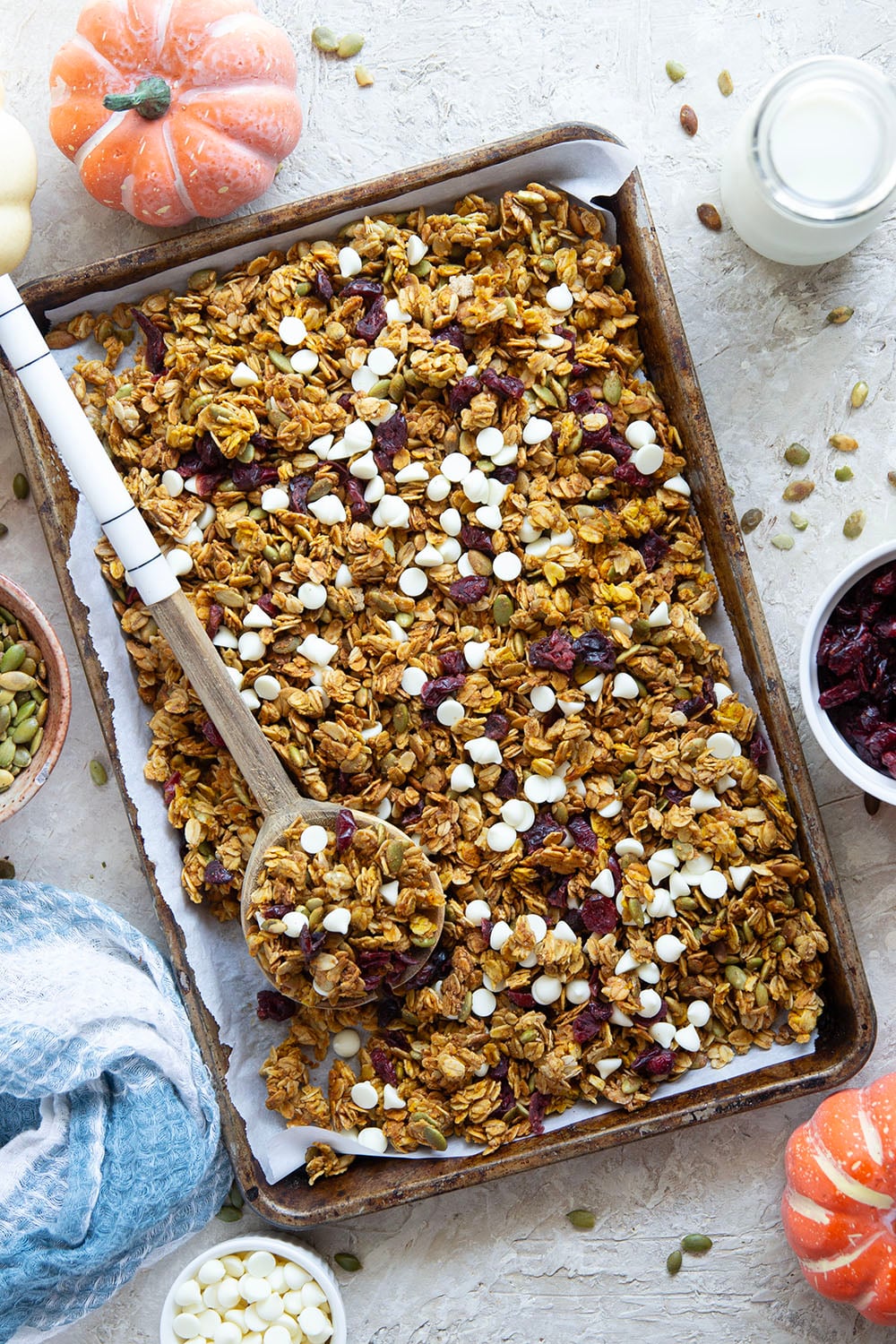 This crisp pumpkin granola has a delightful fall twist of warming spices, real pumpkin puree, white chocolate, and dried cranberries.