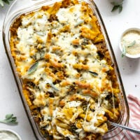 Baked in a creamy pumpkin white sauce with two kinds of cheese and tender sausage bits, this pumpkin baked ziti is a fun fall twist on the classic comfort dish.